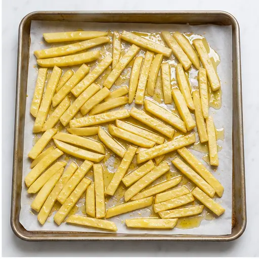 Step 2: Tossing and baking potato fries