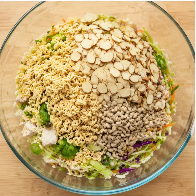 Step 3: Adding crunchy ramen noodles and almonds