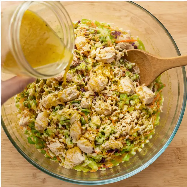 Step 4: Pouring dressing and tossing the finished salad