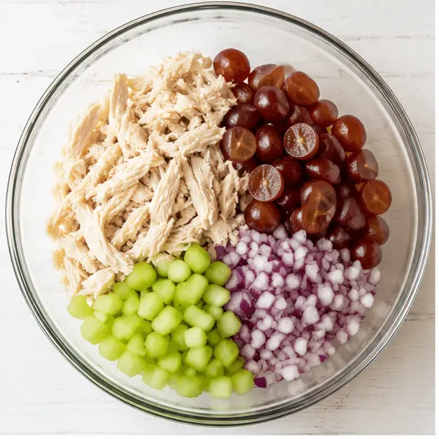Step 1: Combine shredded chicken, grapes, celery, and onion
