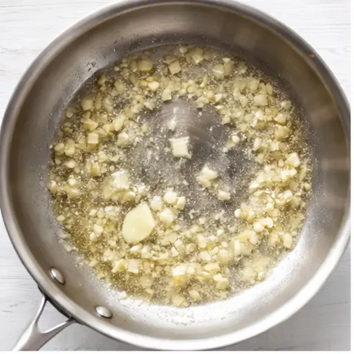 Step 1: Sautéing garlic in melted butter