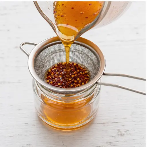 Step 3: Strain through a fine-mesh strainer to remove pepper flakes