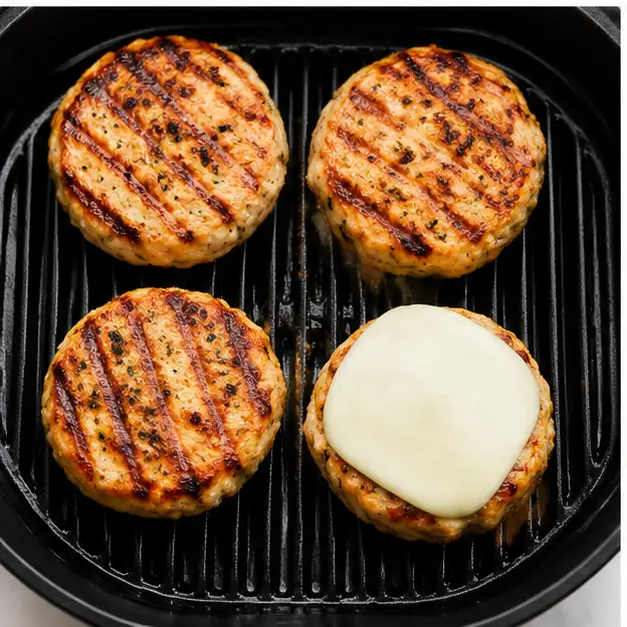 Step 3: Grilling patties with cheese melting on top