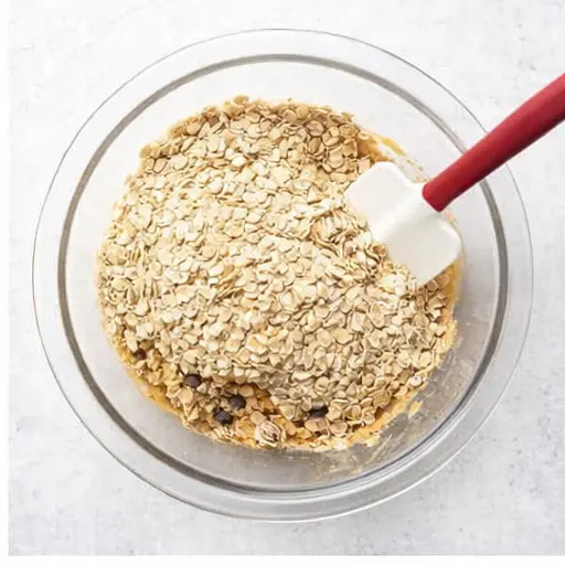 Step 2: Adding rolled oats to the mixture