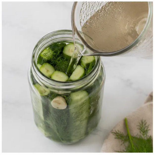 Step 4: Pouring warm brine into jars