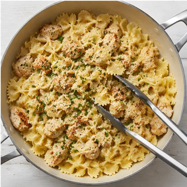 Step 4: Combining pasta, chicken, and sauce together