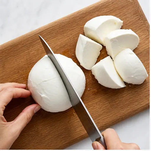 Step 1: Slicing fresh mozzarella into pieces