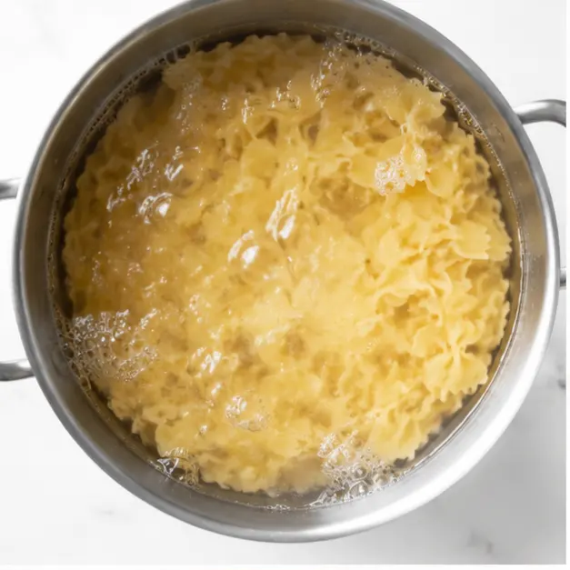 Step 1: Boiling bow tie pasta al dente