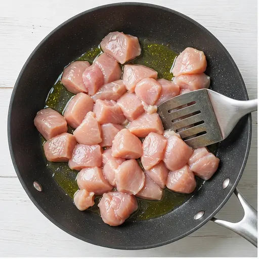 Step 1: Browning cubed chicken fillets in hot oil