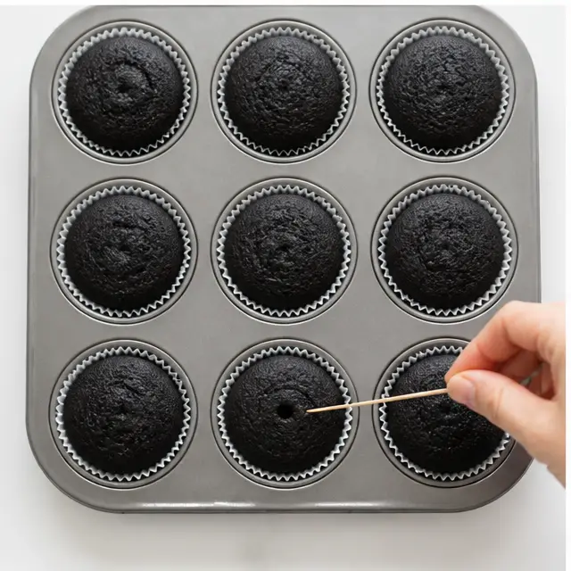 Bake black cupcakes until toothpick comes clean