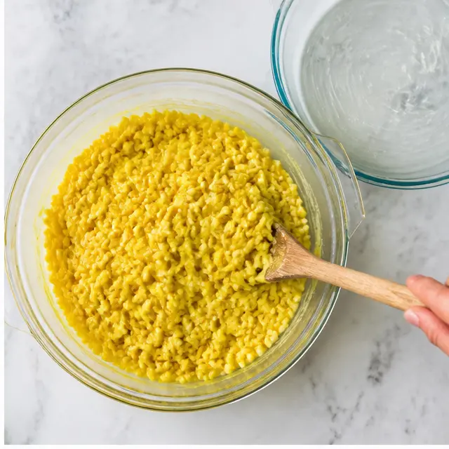 Step 2: Folding crisp rice cereal into the yellow mixture