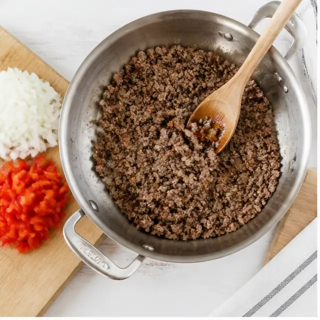 Step 1: Brown ground beef in a skillet with onion and red bell pepper