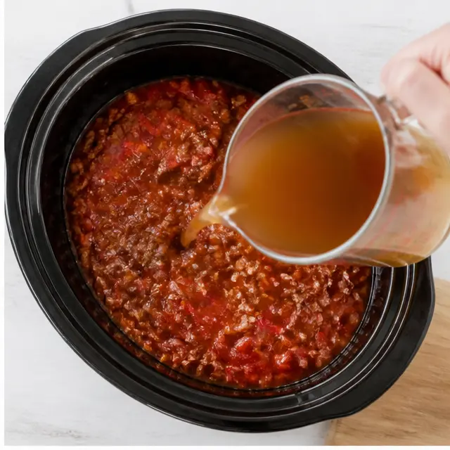 Step 2: Build the soup base with tomatoes, seasonings, and beef broth