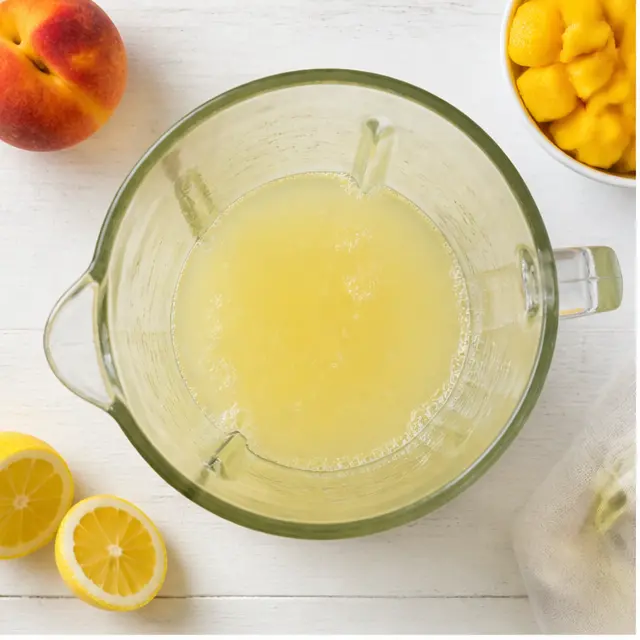 Step 1: Pouring chilled lemonade and cold water into the blender jar