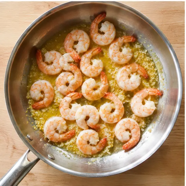 Step 3: Searing shrimp until pink and curled into a loose C