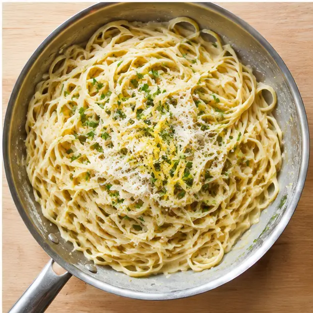 Step 4: Tossing pasta with glossy lemon and Parmesan butter sauce