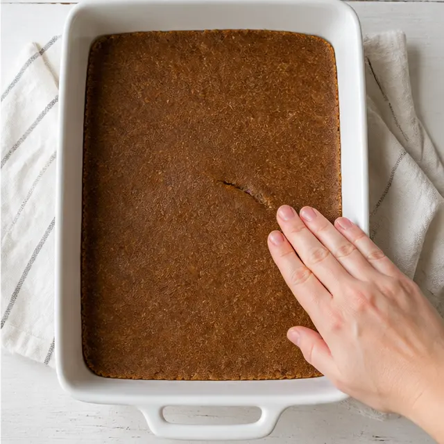 Press dough into the pan and bake until just set