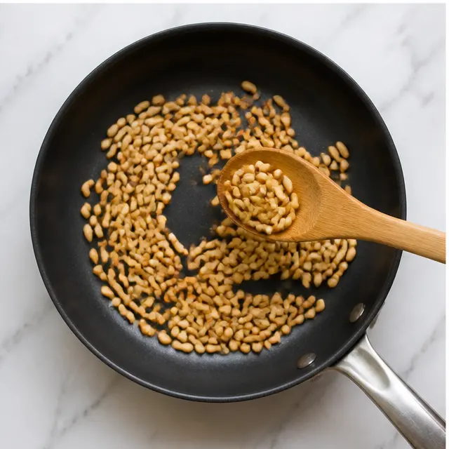 Toast the pine nuts golden brown