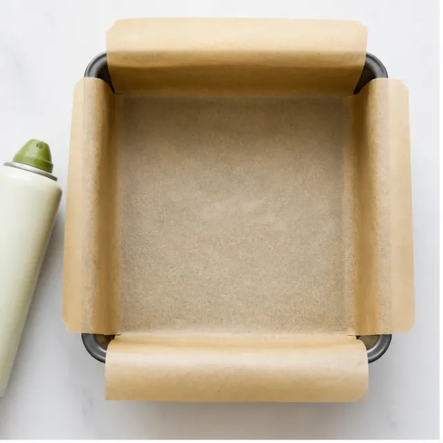 Line the 9-inch square baking pan with parchment paper, leaving an overhang for easy lifting.