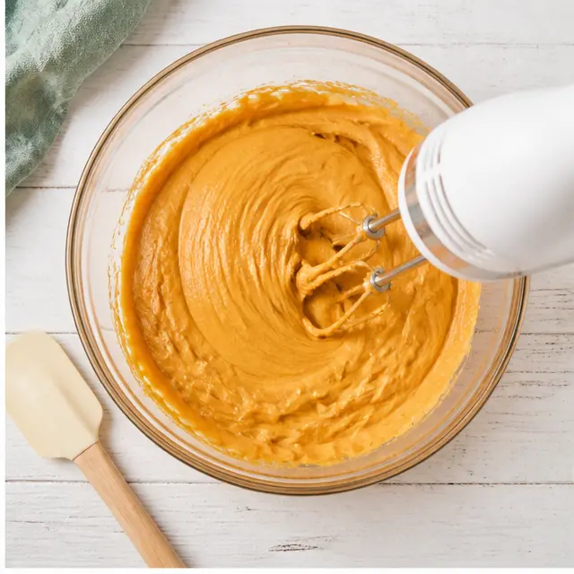 Step 2: Beating the cream cheese and pumpkin puree into a smooth filling