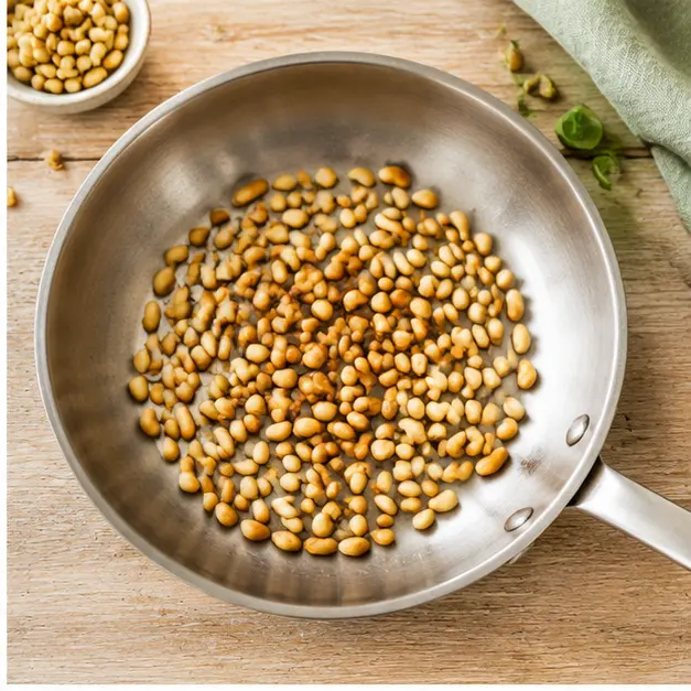 Step 2: Toast pine nuts in a dry skillet until golden