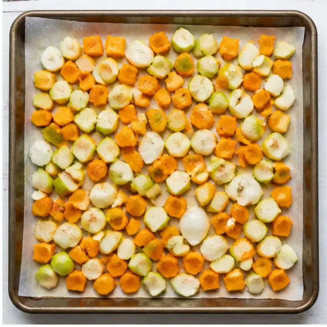 Step 2: Roasting cubed butternut squash, apple, and onion on a sheet pan