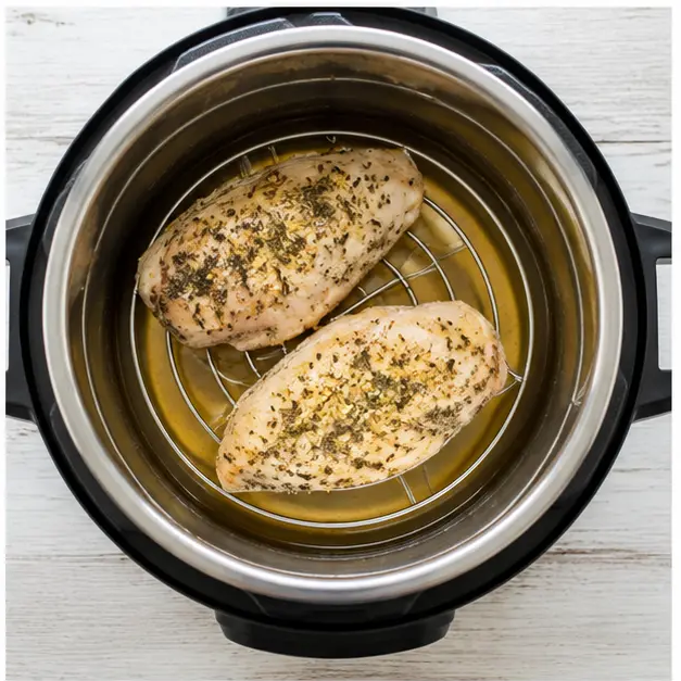 Arrange seasoned fillets on trivet over chicken broth in pot