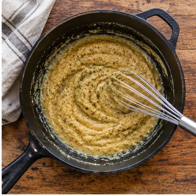 Step 2: Flour, oregano, pepper and salt whisked into a smooth golden paste